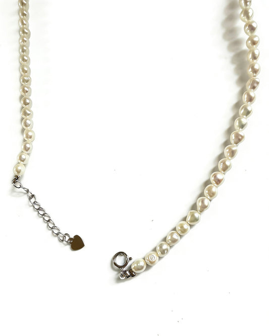 Minimalist baroque freshwater pearl necklace with 925 sterling silver clasp and extender chain.