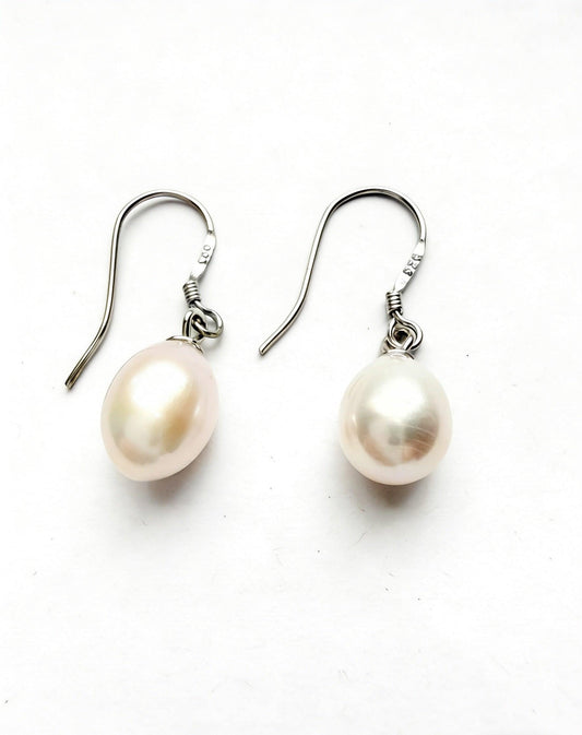 Baroque freshwater pearl drop earrings with natural white/cream 7-8mm pearls and 925 sterling silver hooks.